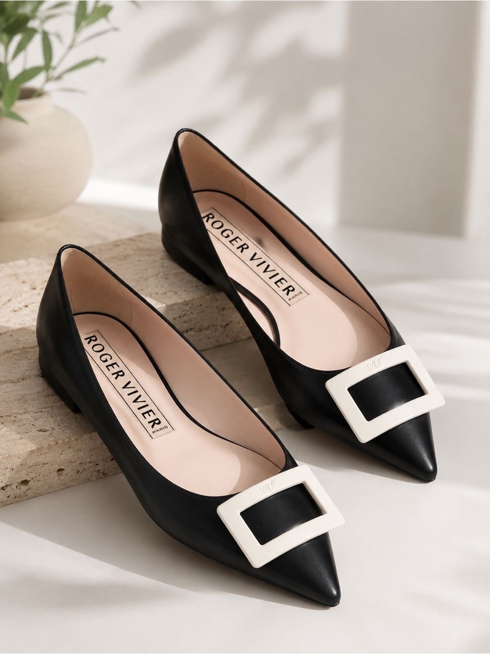 Roger Vivier black leather pointed-toe flats with the signature oversized buckle